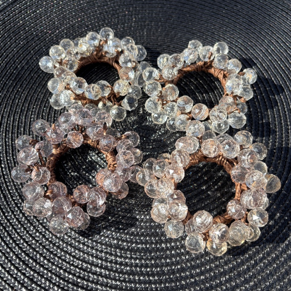 Set Of 4 Clear Beaded Napkin Rings On Wooden Frame